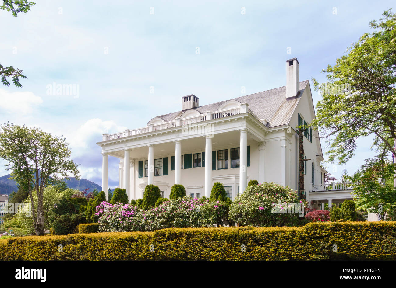 South facade and gardens exterior of the Alaska State governor's mansion, Juneau, Alaska, United States Stock Photo