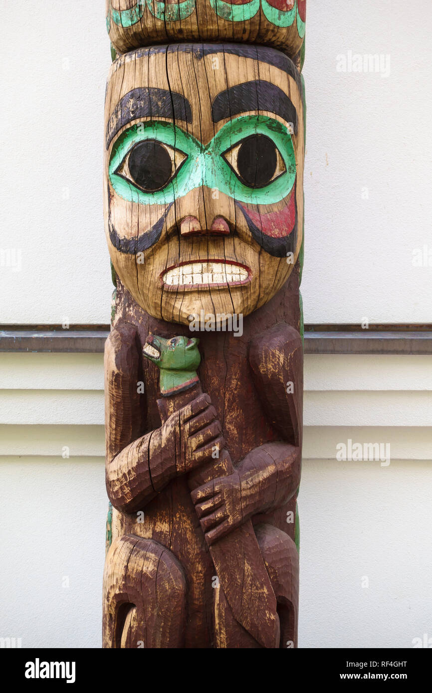 Detail of a traditional Northwest Coast Native American Tlingit Indian totem pole outside the Alaska State governor's mansion in Juneau, Alaska Stock Photo