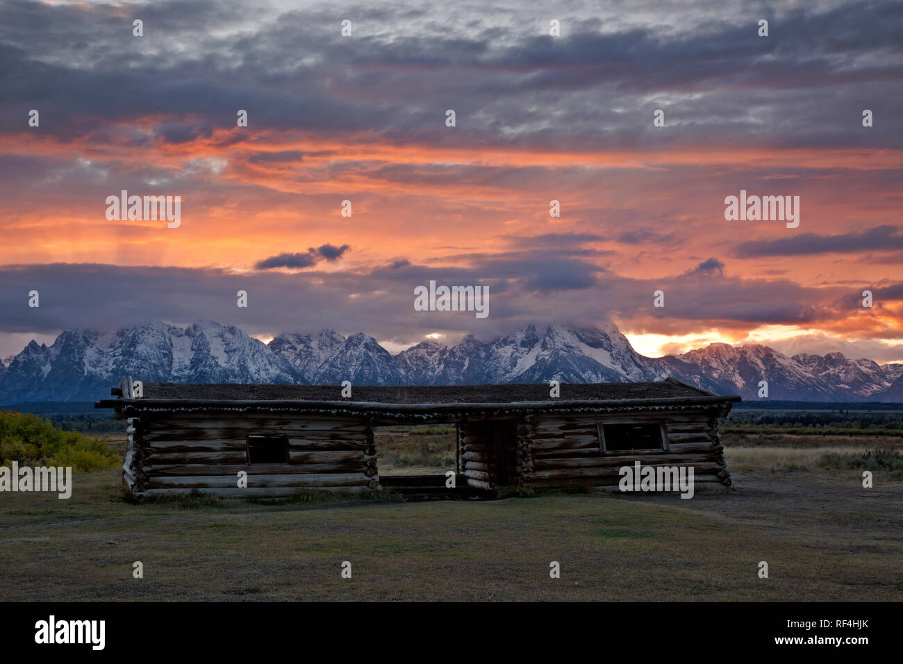 WY02918-00...WYOMING - Sunset over the Teton Range from the historic Cunningham Cabin in Grand Teton National Park. Stock Photo