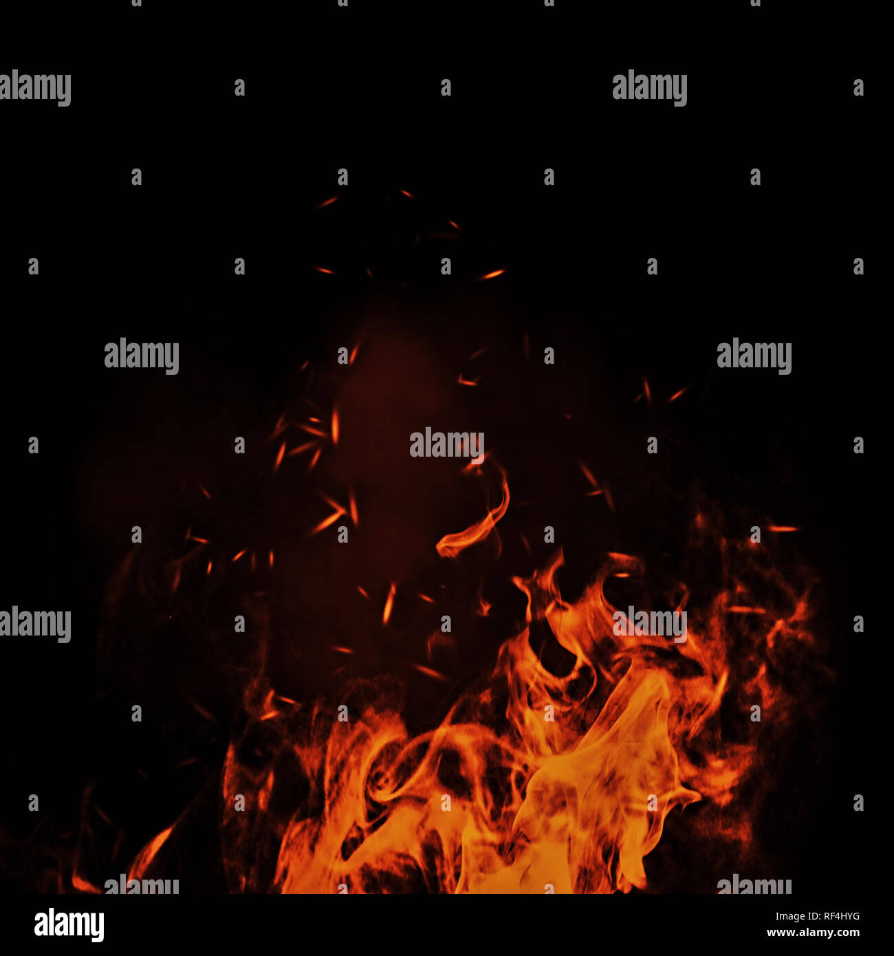 Vintage abstract flames with fire particles embers on isolated background. Stock Photo
