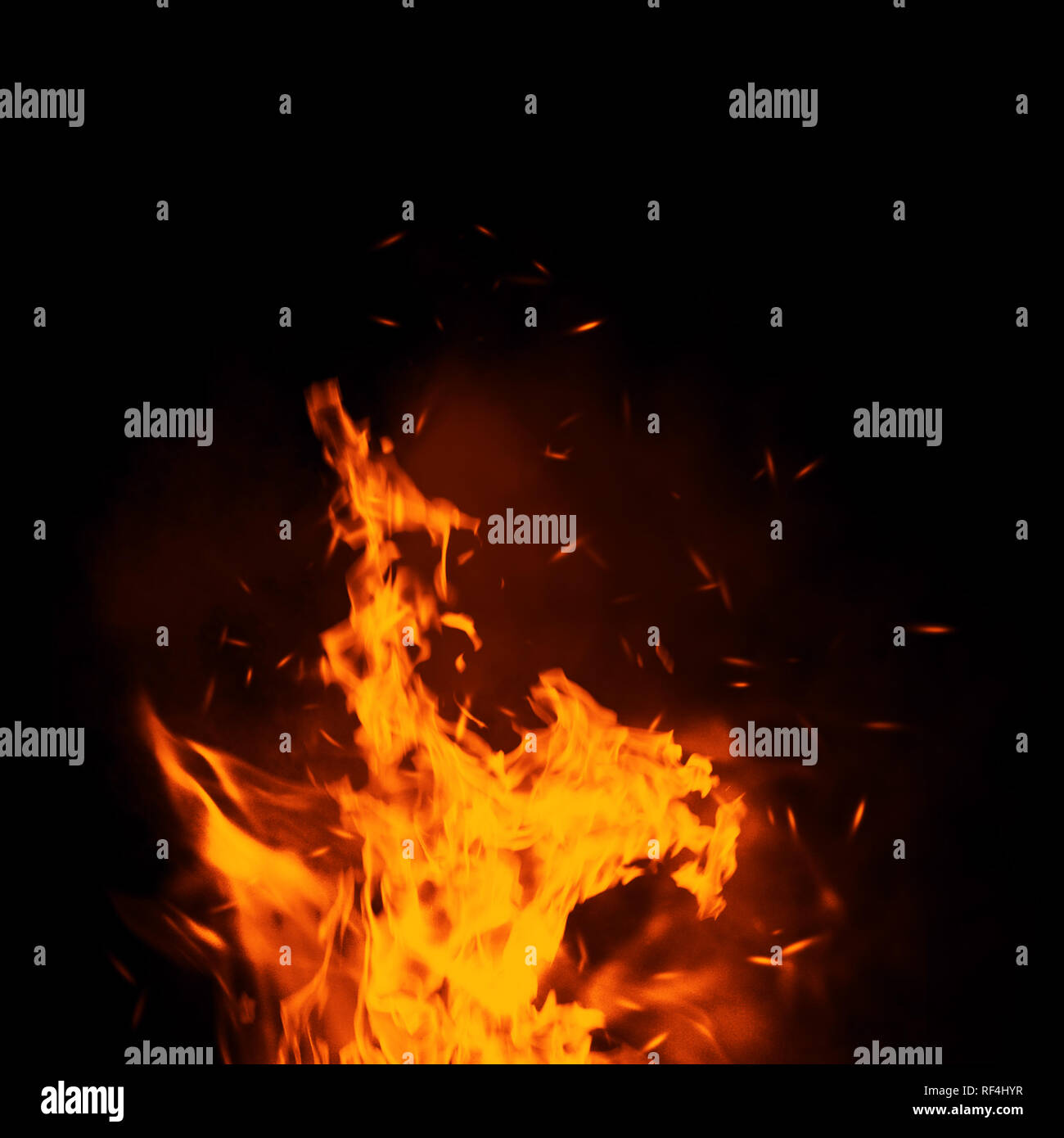 Texture of burn fire with particles embers. Flames on isolated black background. Stock Photo