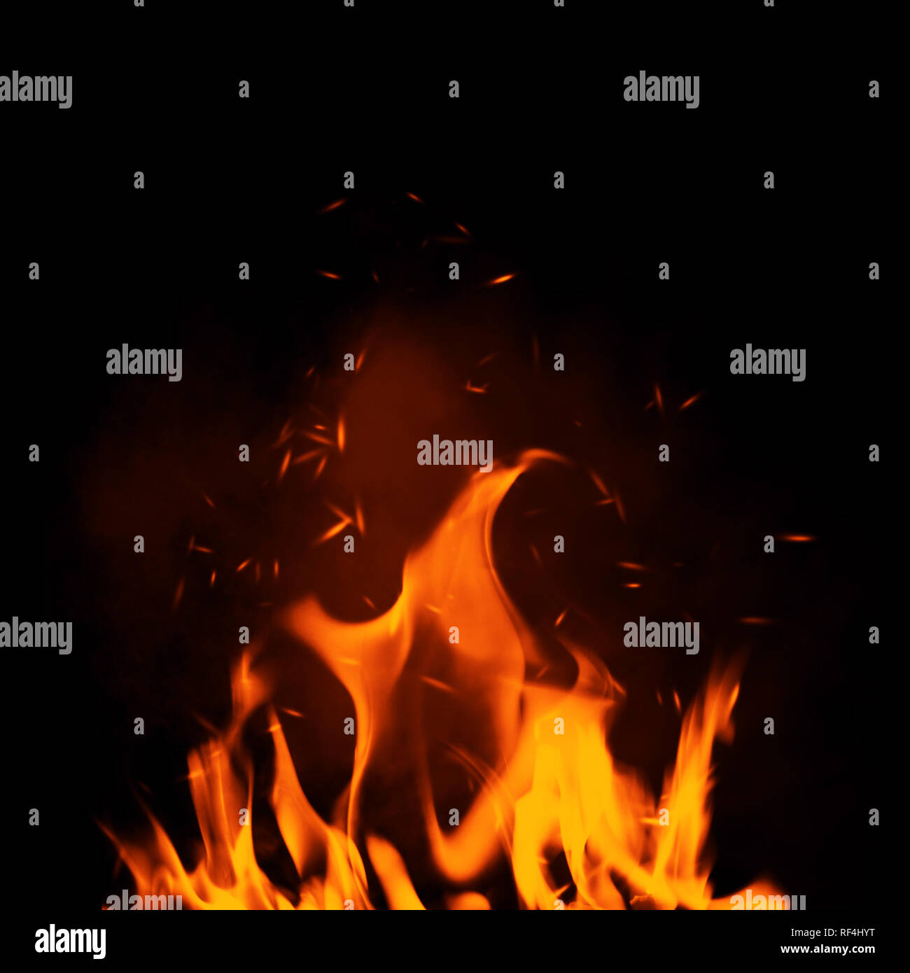 Texture of burn fire with particles embers. Flames on isolated black background. Stock Photo