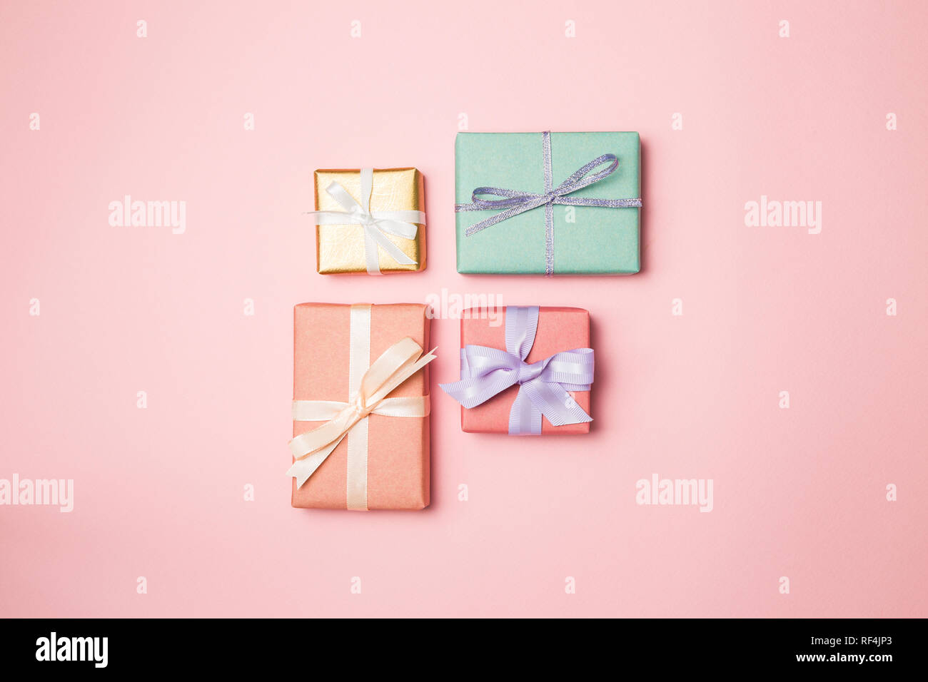 Colorful gift boxes isolated on pink background Stock Photo