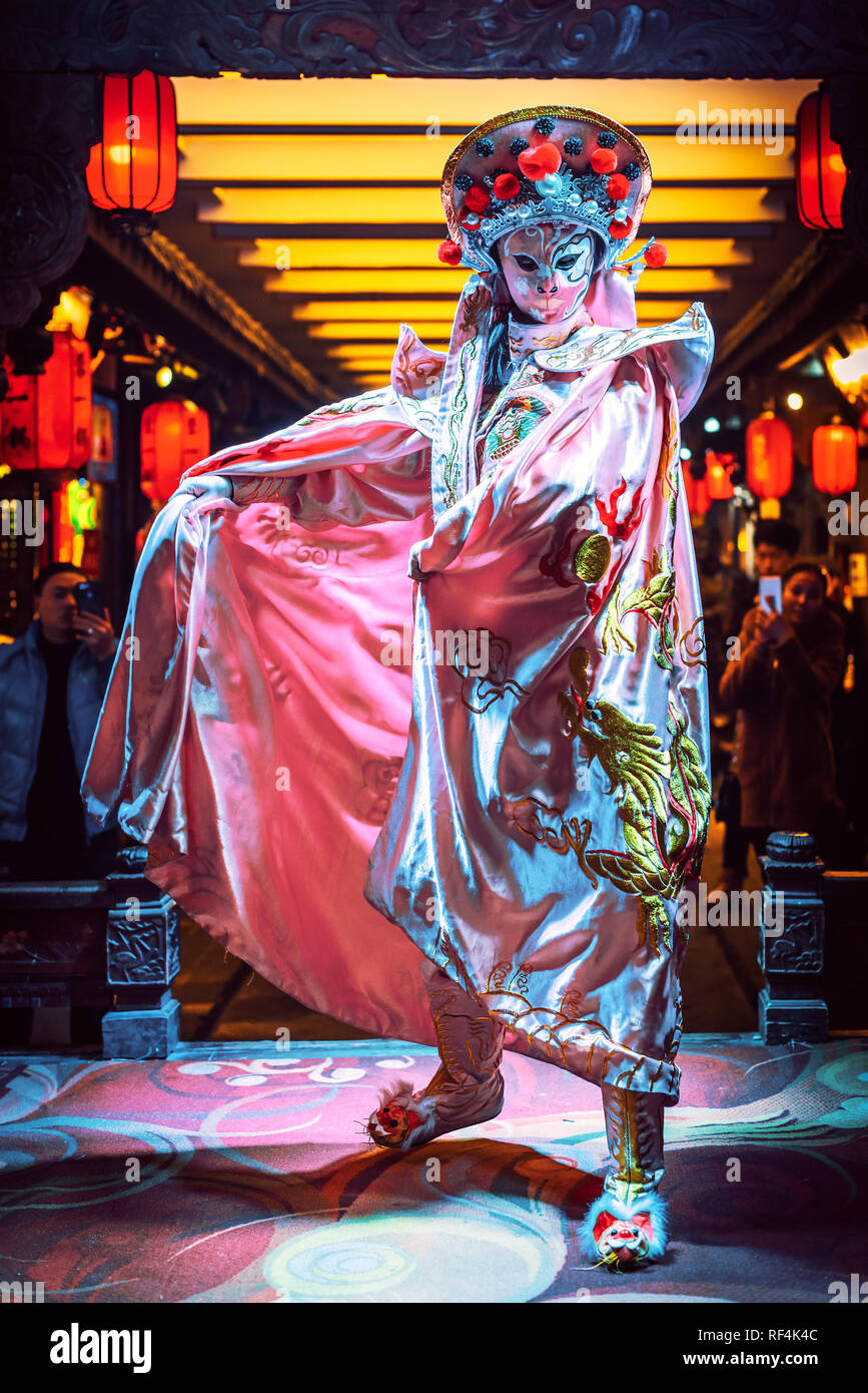 Chengdu, Sichuan Province, China - Jan 19, 2019: Chinese actress performs a public traditional face-changing art or bianlian onstage at Chunxifang Chu Stock Photo