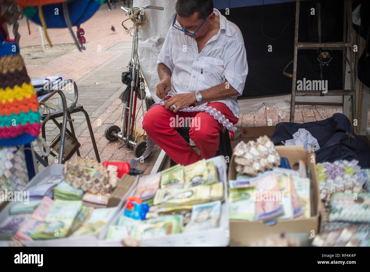Figures or crafts made with Bolivarian tickets made by Venezuelan immigrants in the border city of Cúcuta Stock Photo