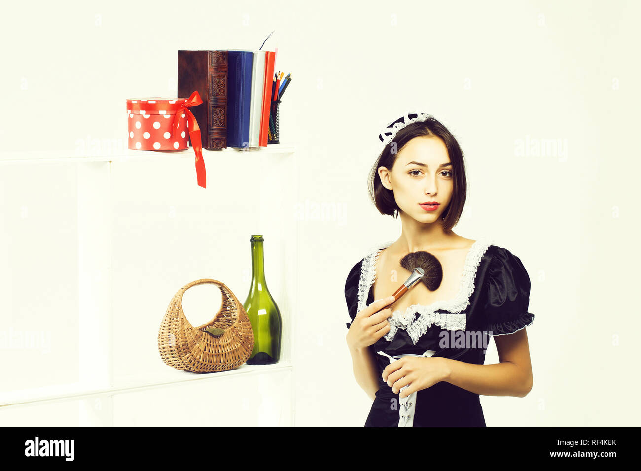 https://c8.alamy.com/comp/RF4KEK/pretty-girl-in-maid-costume-RF4KEK.jpg