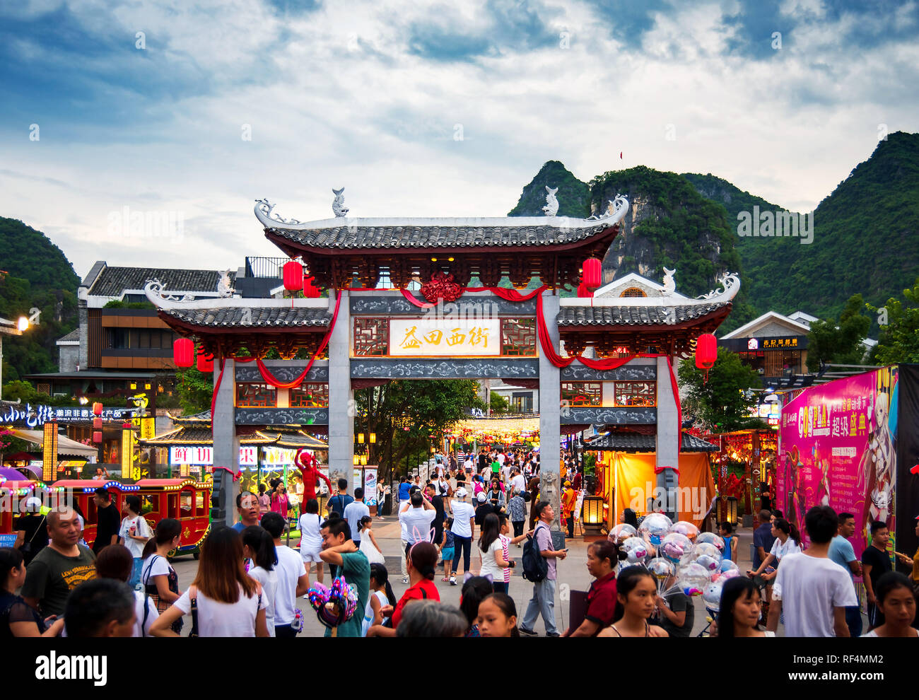 Yangshuo, China - July 27, 2018: Crowded Chinese gate at a popular travel city of Yangshuo near Guilin in Guangxi province of China Stock Photo