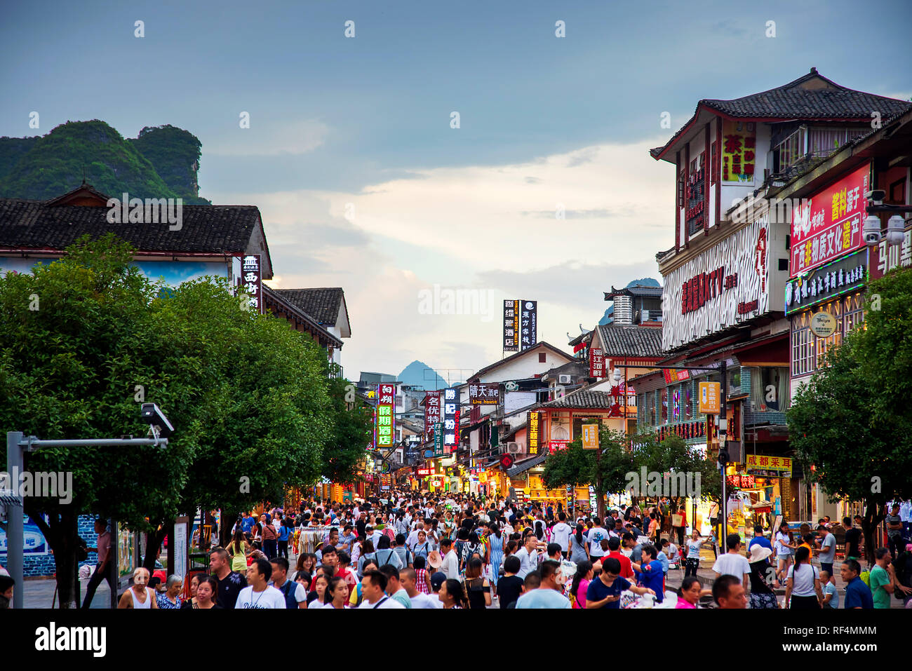 Yangshuo, China - July 27, 2018: Crowded street of a popular travel city of Yangshuo near Guilin in Guangxi province of China Stock Photo