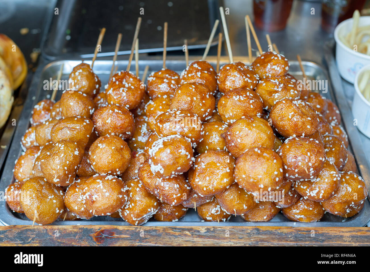 Fried sesame sweet sticky rice balls skewers Tang You Guo Zi