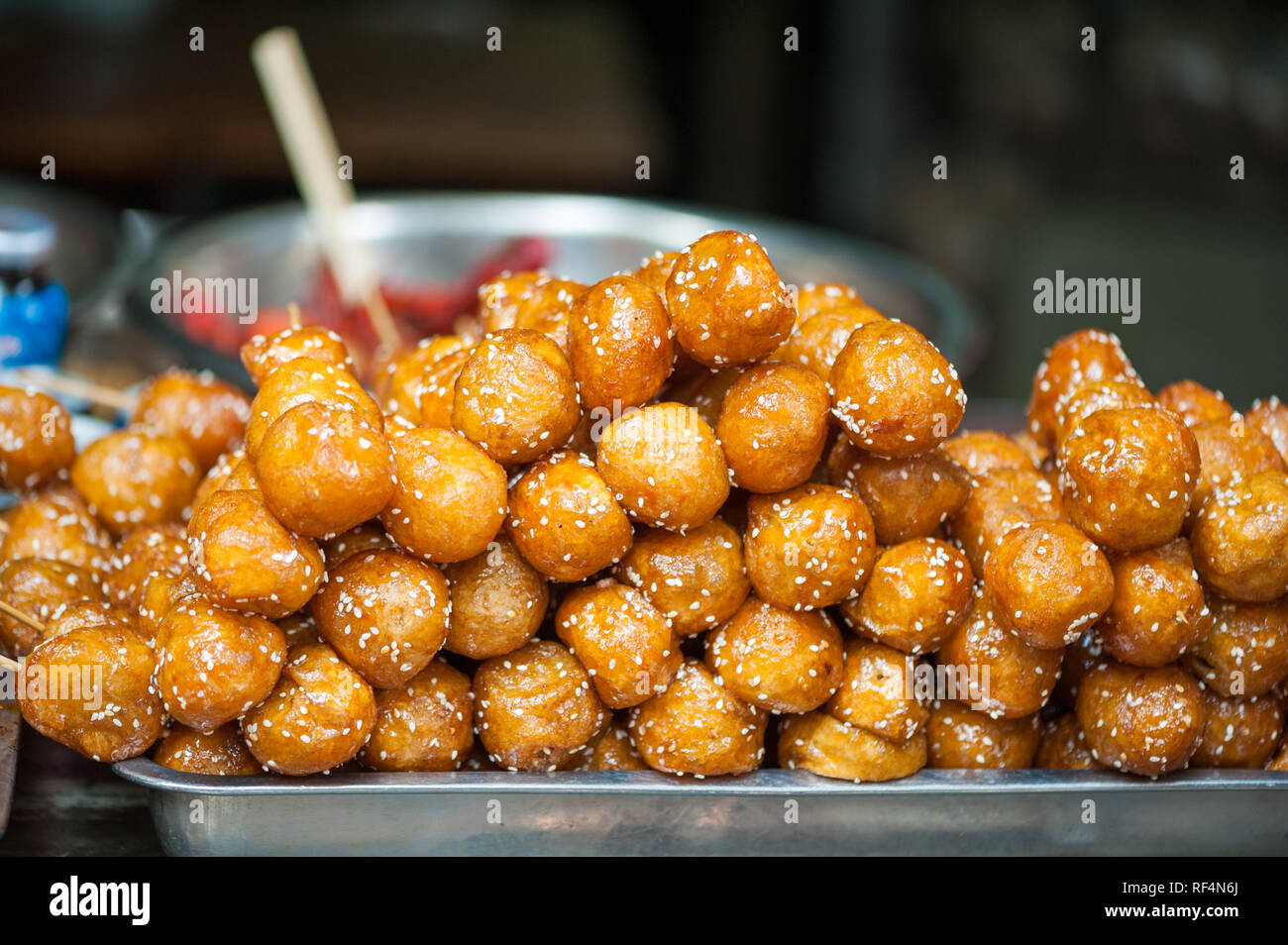 Fried sesame sweet sticky rice balls skewers Tang You Guo Zi
