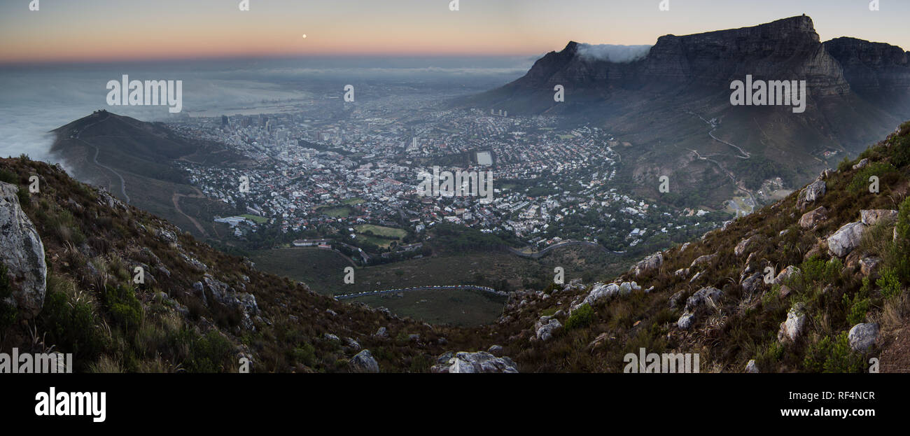 Hiking up Lion's Head for views of the full moon over Cape Town, Western Cape Province, South Africa is a popular activity. Stock Photo