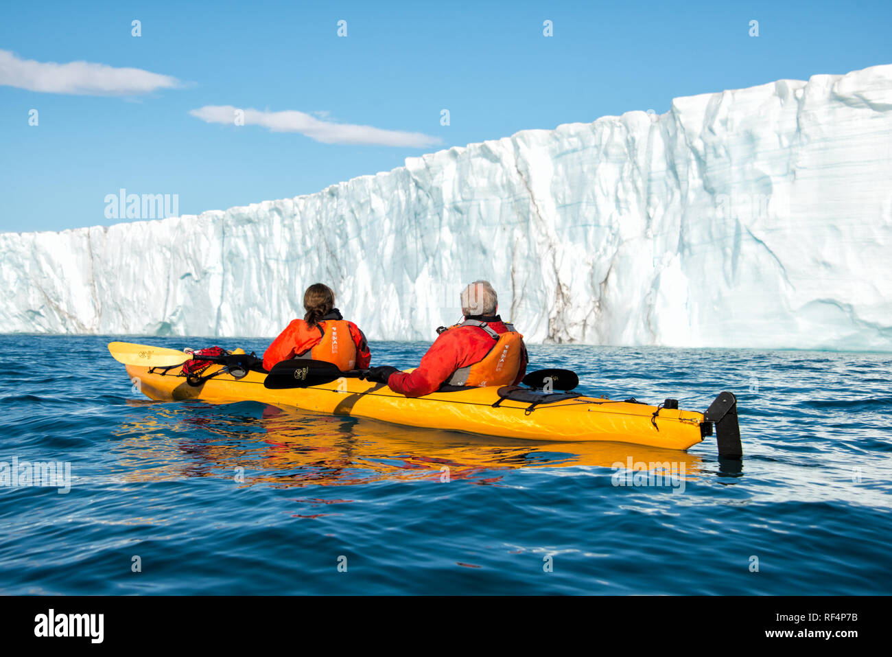 BRASVELLBREEN GLACIER, Svalbard — Kayakers navigate the icy waters near the Brasvellbreen glacier, one of the most impressive glaciers in the Svalbard archipelago. This unique kayaking experience offers visitors a close encounter with the Arctic landscape, highlighting the vast and awe-inspiring natural beauty of the region. Stock Photo