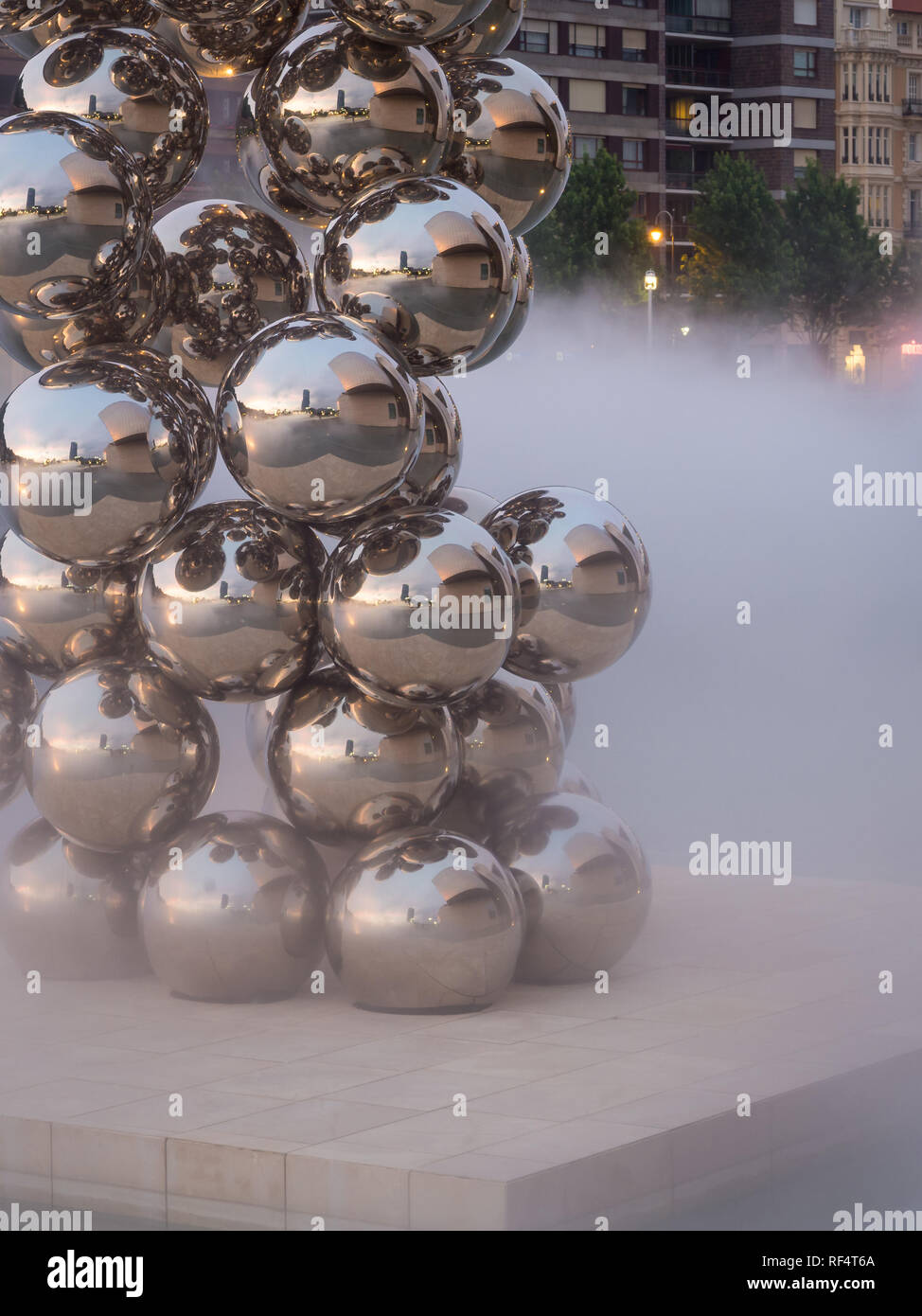 BILBAO, SPAIN - JULY 08, 2018: Sculpture 'The Big Tree' consisting of 80 stainless steel balls with reflections by Anish Kapoor in front of The Guggen Stock Photo