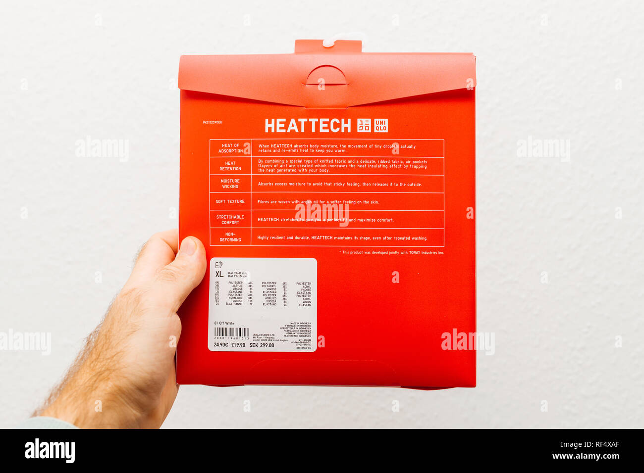 Paris, France - Dec 21, 2018: Man holding against white background a new  pacakge with Heattech material description manufactured by Uniqlo Japanese  casual wear designer, manufacturer and retailer Stock Photo - Alamy