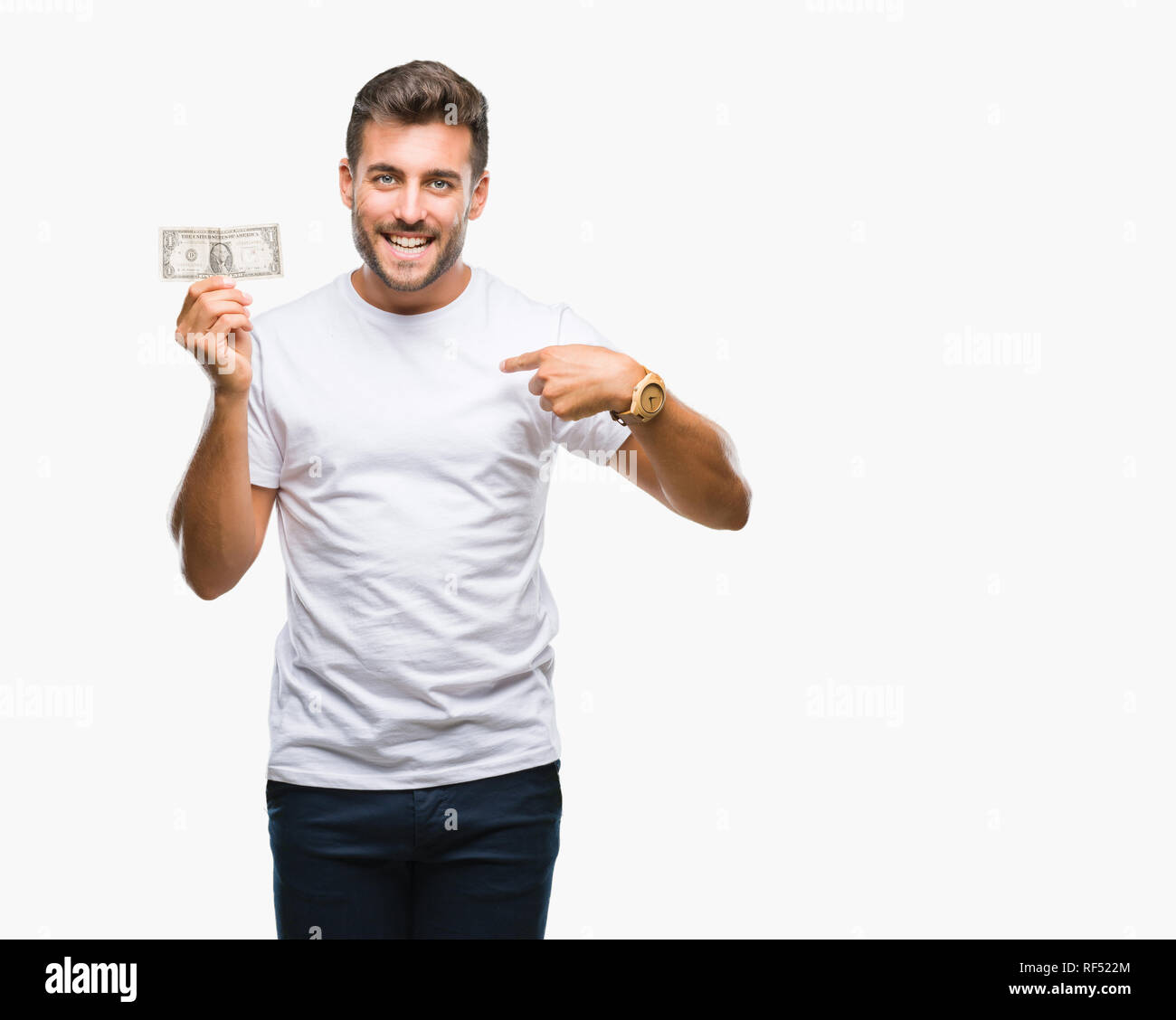 Young handsome man holding dollars over isolated background with ...