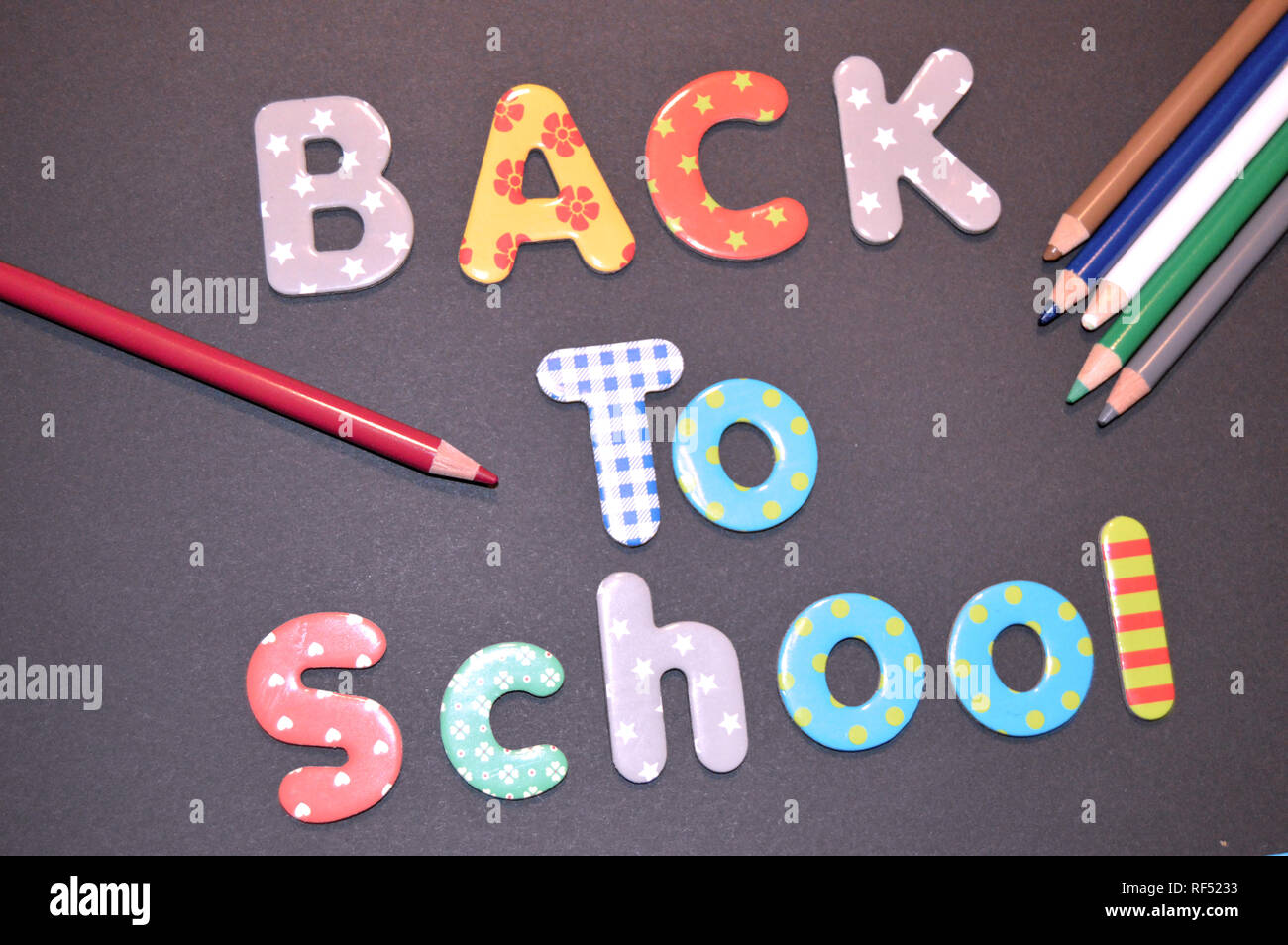 Illustration of the back to school with letters and colored pencils Stock Photo