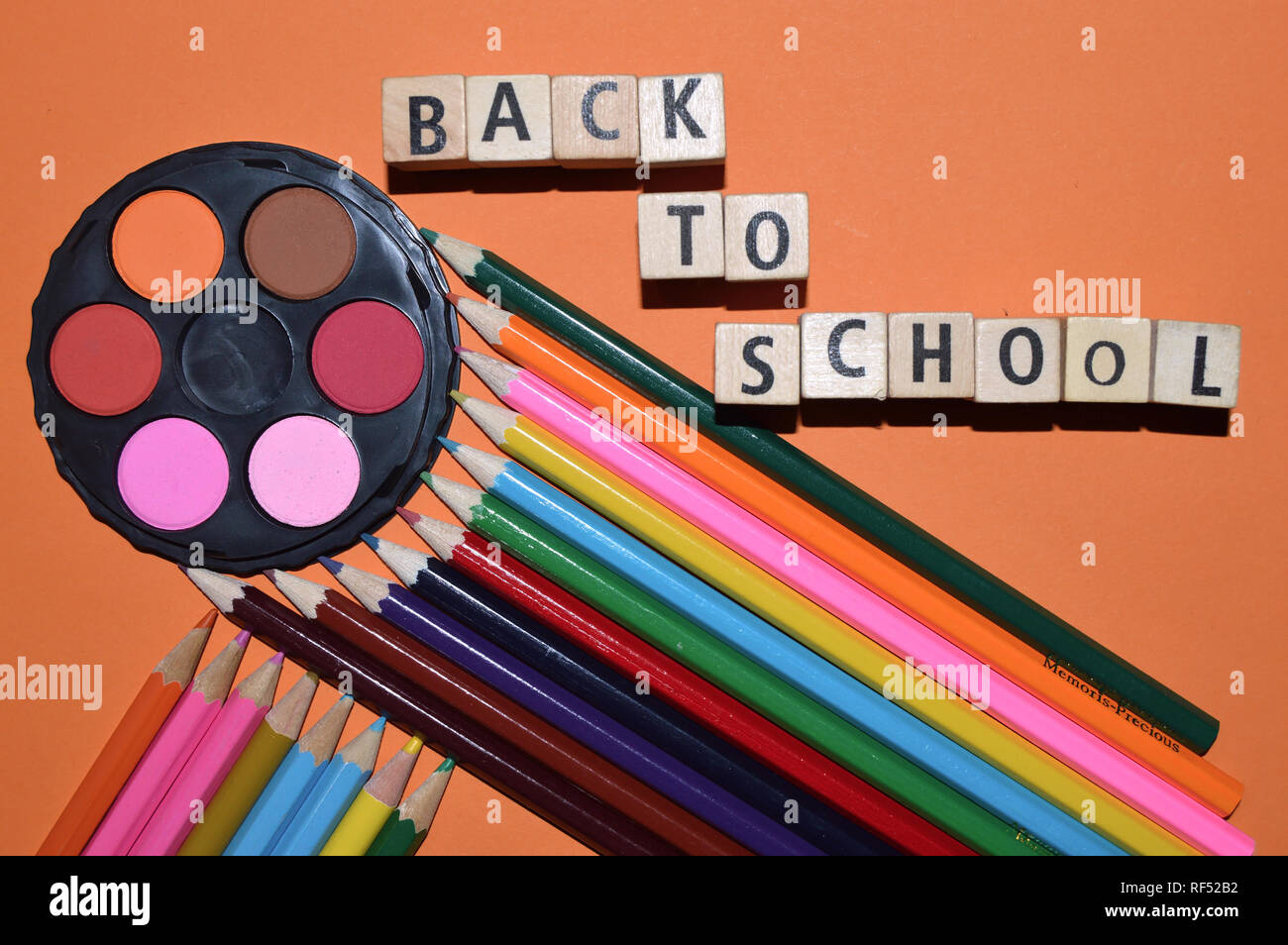 Back to school as background.Watercolours and colours pencils on the table Stock Photo