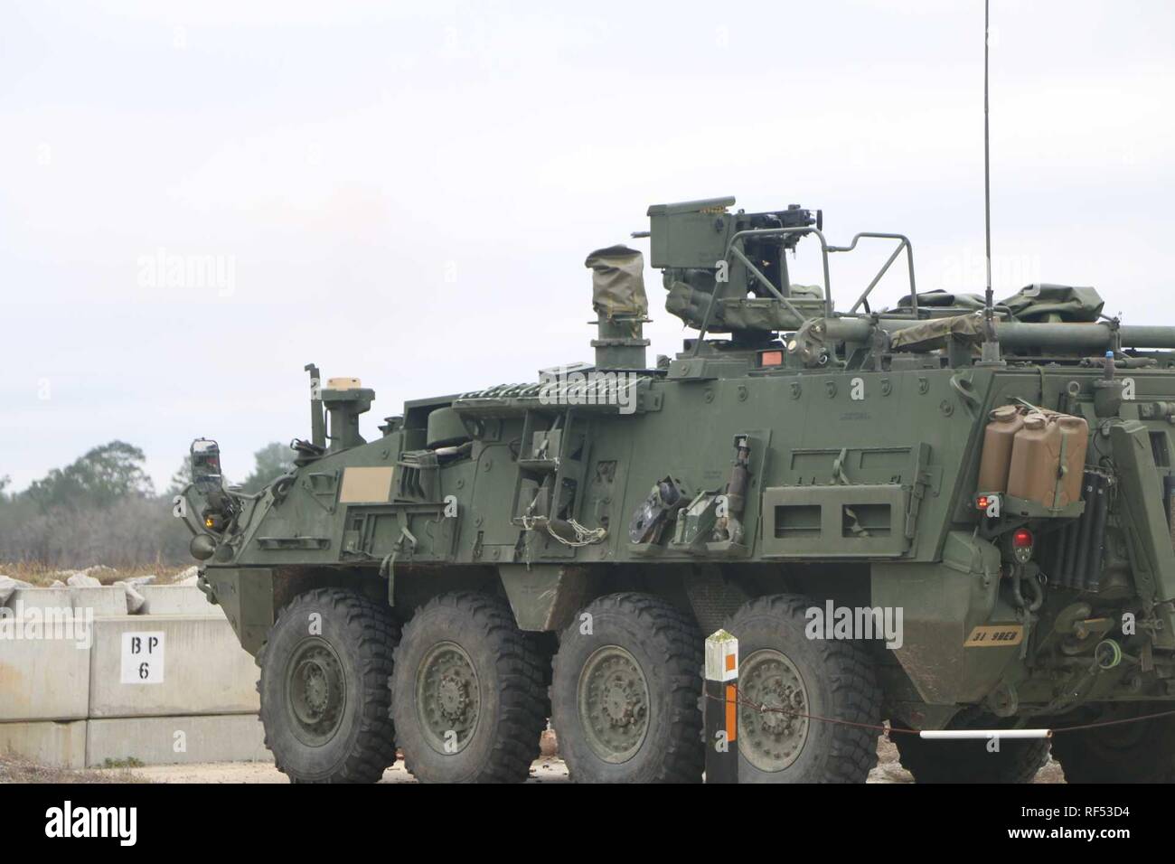 A Interim Armored Vehicle (Stryker) of 9th Brigade Engineer Battalion, 2nd Armored Brigade Combat Team, 3rd Infantry Division enters the first engagement area Jan. 15, at Fort Stewart,Ga. This is where teams get their first target engagements to enhance aim before moving on to the graded portion of the range.(U.S. Army photo by Spc. Matthew Williams/released) Stock Photo