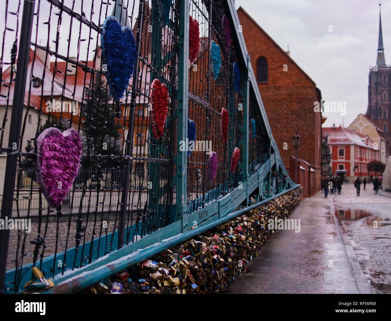 Tumski Bridge or Lovers Bridge with Love Locks on it in winter and light snow Stock Photo