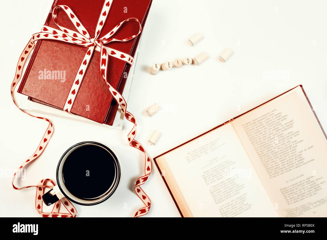 Valentines day background. Stack of books with ribbon Stock Photo - Alamy