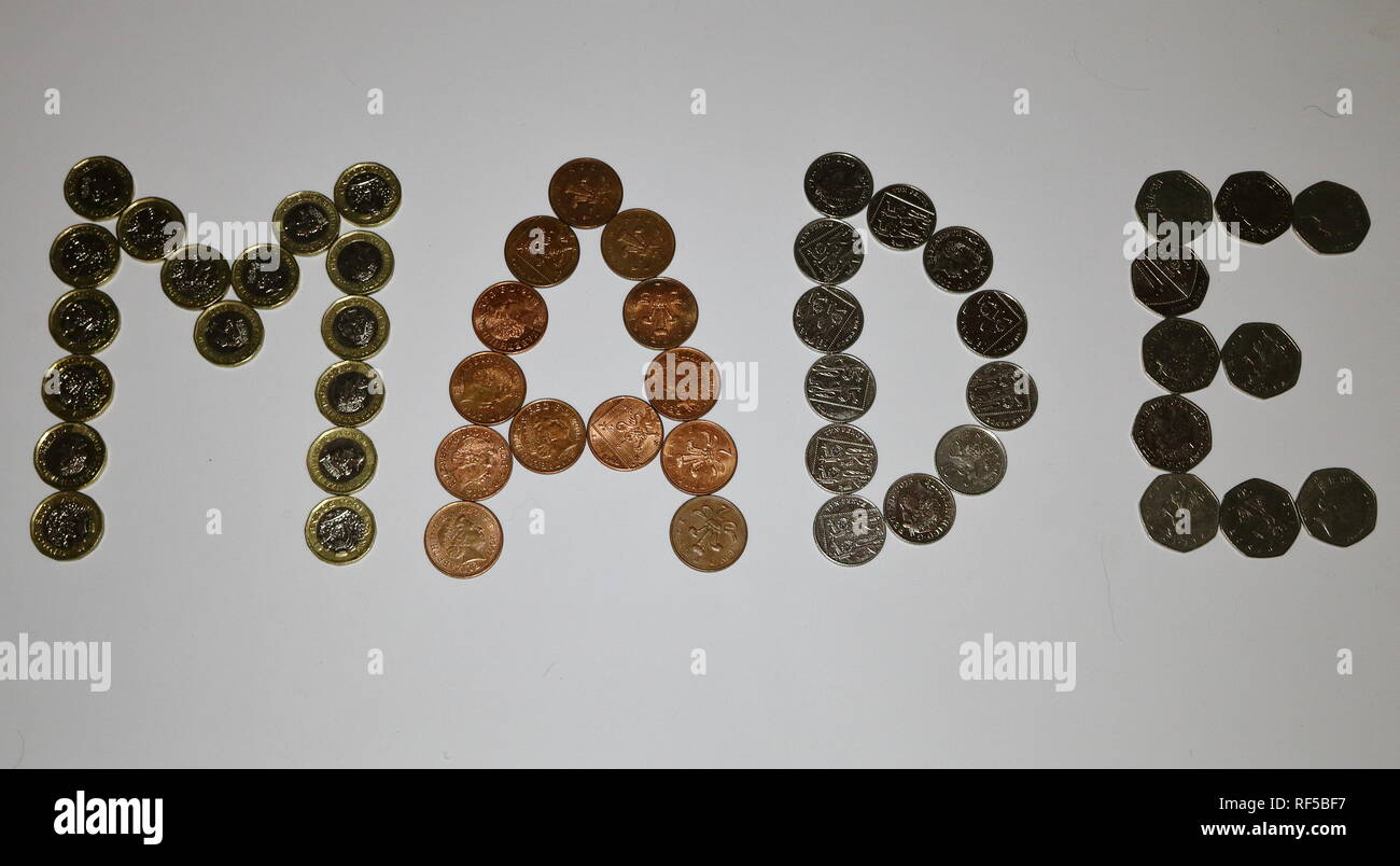 Sterling currency coinage spelling the word MADE (Made of money) Stock Photo