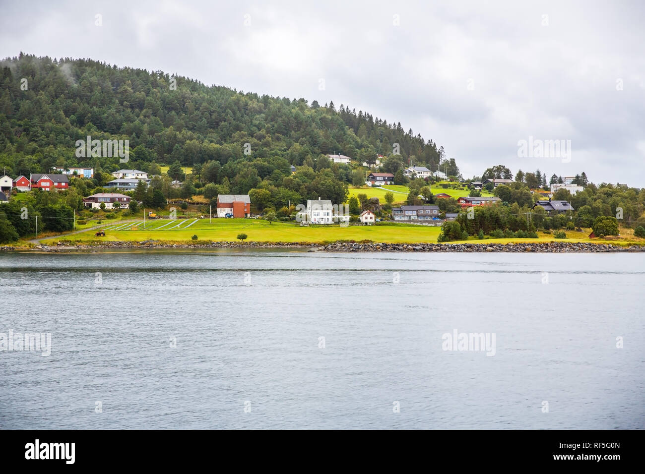 Landscape with village, forest and fjord in Norway Stock Photo - Alamy