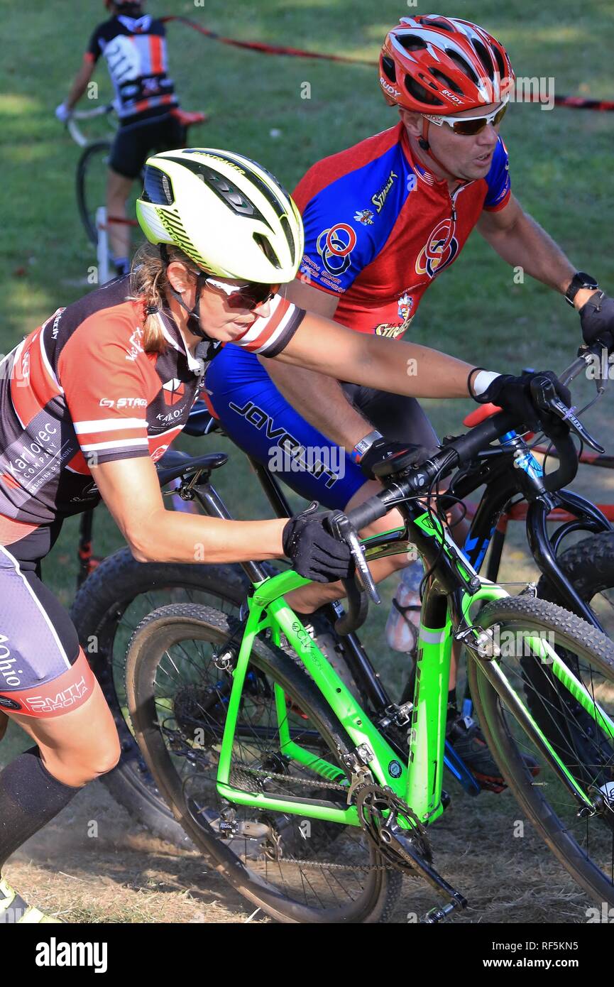 Competitive cycling race event with males and females Stock Photo - Alamy