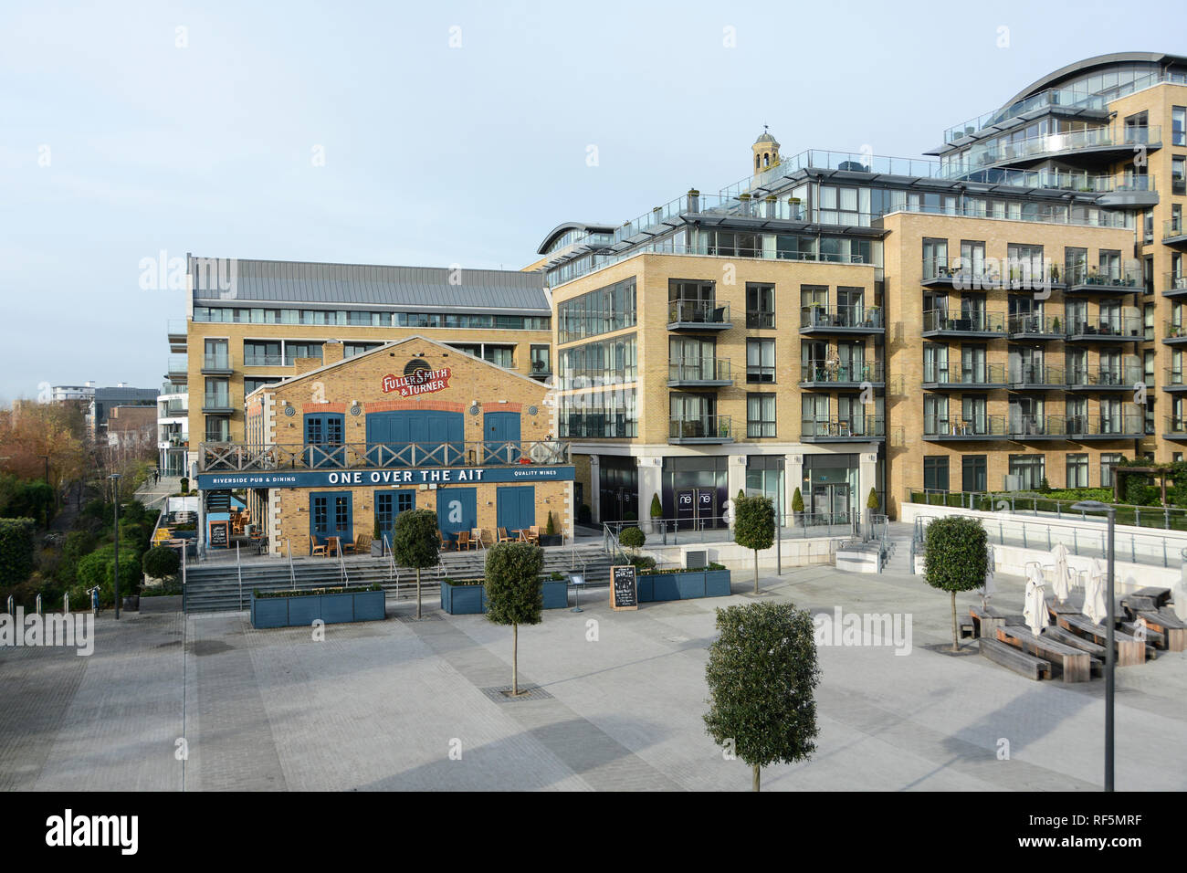 New apartment development and the One Over the Ait Public House, Kew Bridge Road, Brentford, London, TW8, UK Stock Photo