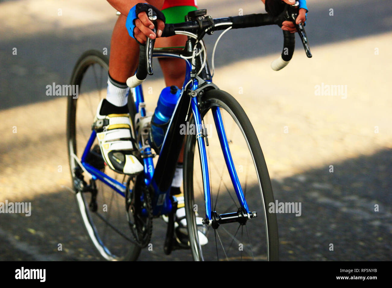 close up of a road cyclist holding the bike handlebar during a road race competition Stock Photo