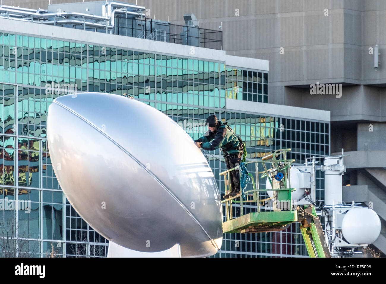 Worker prepares for Super Bowl LIII with installation of giant Vince Lombardi Trophy sculpture in Atlanta, Georgia's Centennial Olympic Park. (USA) Stock Photo