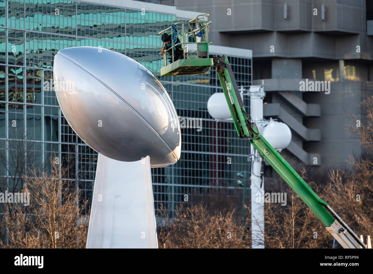 Worker prepares for Super Bowl LIII with installation of giant Vince Lombardi Trophy sculpture in Atlanta, Georgia's Centennial Olympic Park. (USA) Stock Photo