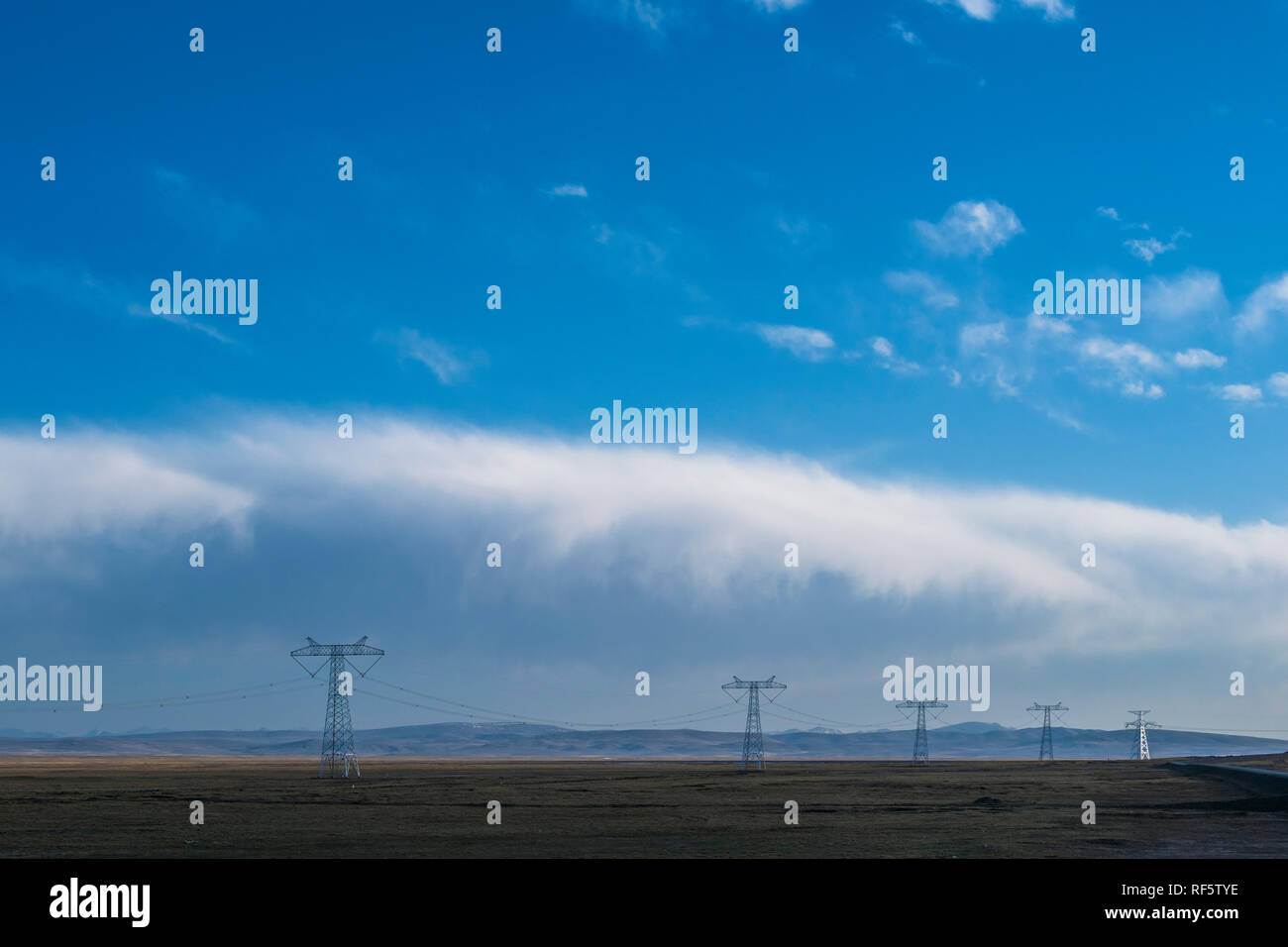 High voltage towers with sky background Stock Photo - Alamy