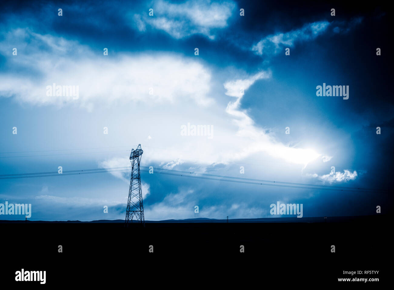 High voltage towers with sky background Stock Photo - Alamy