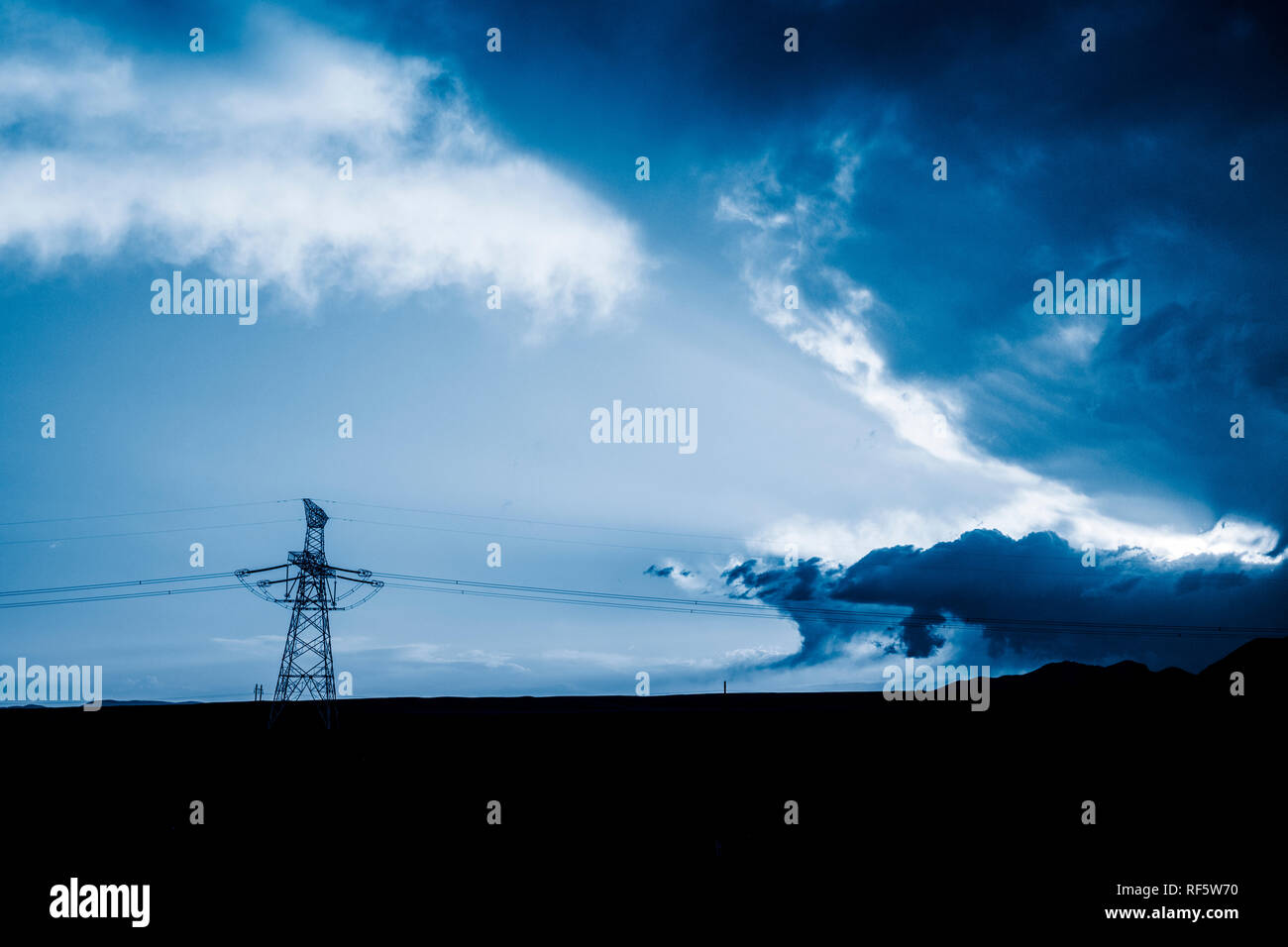 High voltage towers with sky background Stock Photo - Alamy