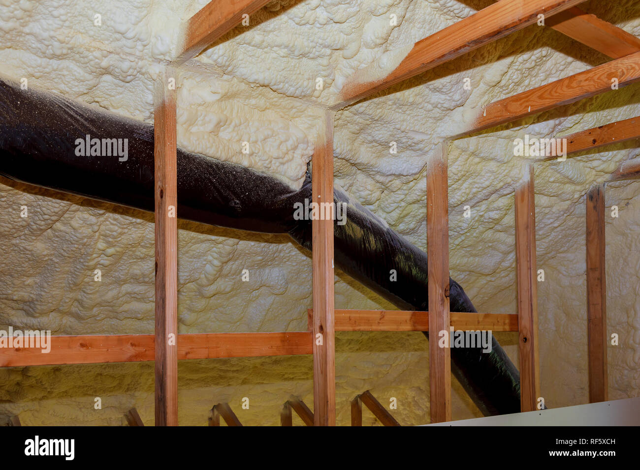 Foam Plastic Insulation Installed In The Sloping Ceiling Of New