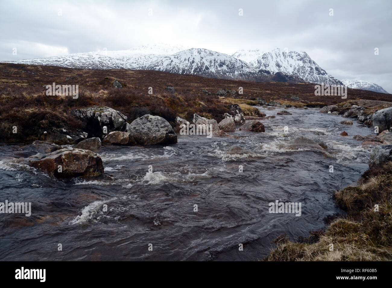The River Etive with the snowy peaks of the Scottish Highlands in the background, Glencoe region, Scotland, United Kingdom. Stock Photo