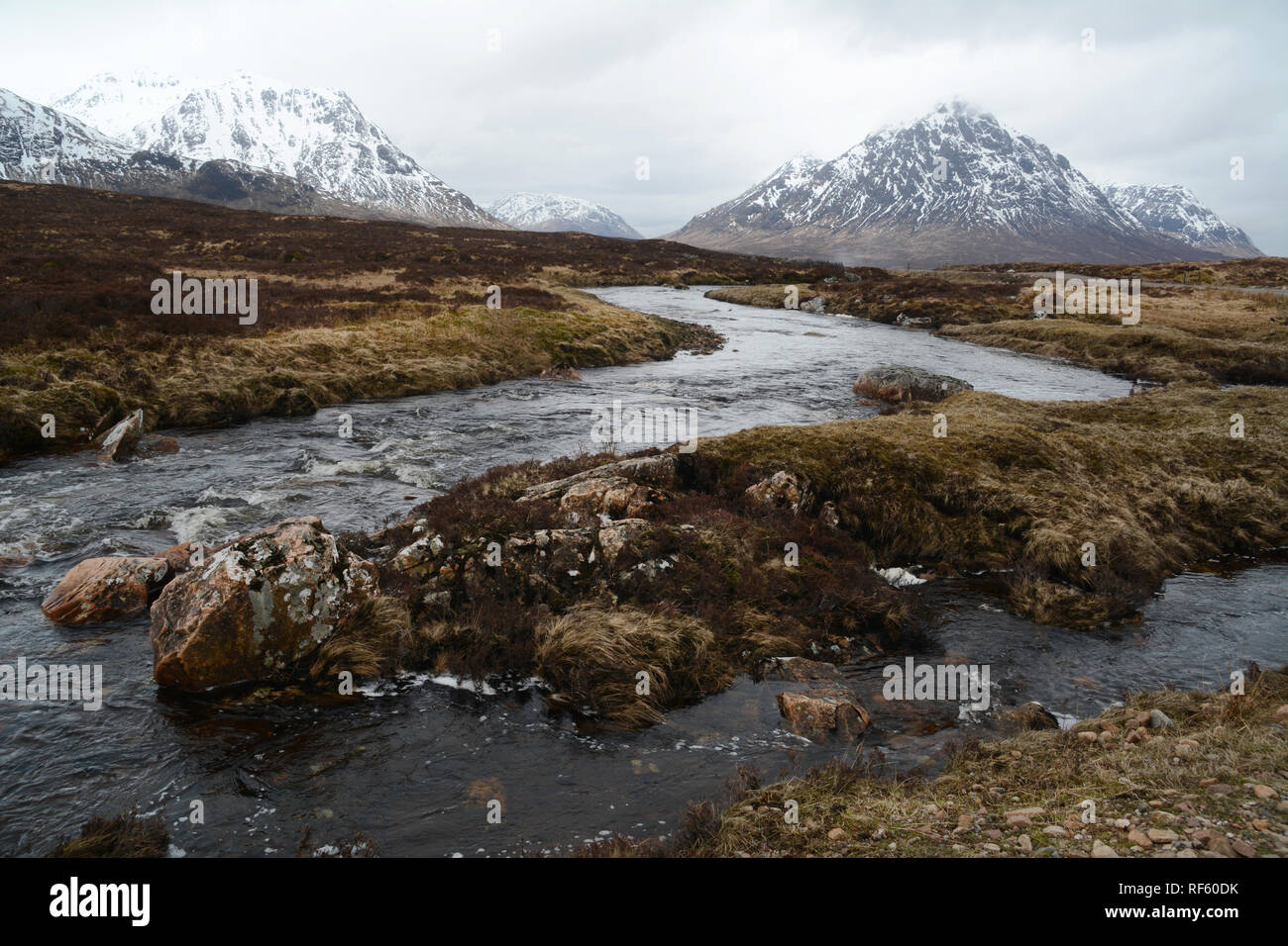 The River Etive with Buachaille Etive Mor and snowy peaks of the Scottish Highlands in the background, Glencoe region, Scotland, United Kingdom. Stock Photo