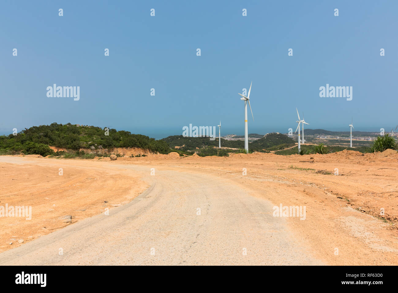Wind turbines along empty hi-res stock photography and images - Alamy