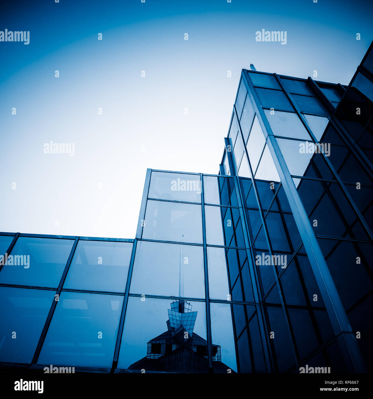 facade of modern office building, blue toned images Stock Photo - Alamy