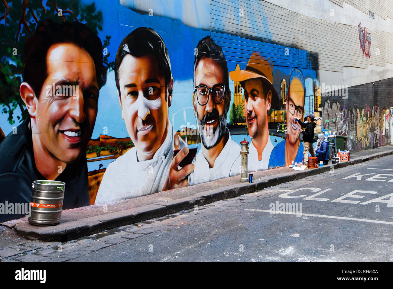 Melbourne laneway where street artists are painting mural of five internationally renowned chefs, Victoria Australia Stock Photo