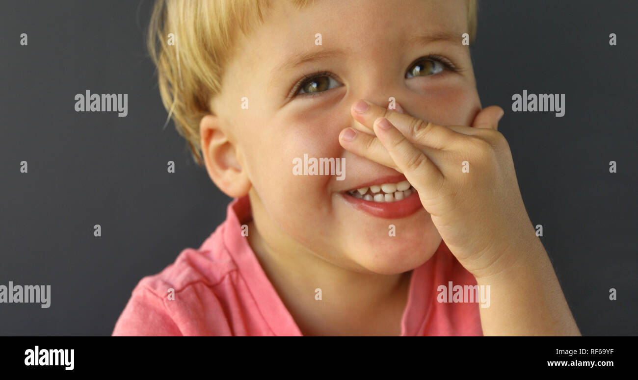 Cute Little Boy Point at His Nose Stock Photo