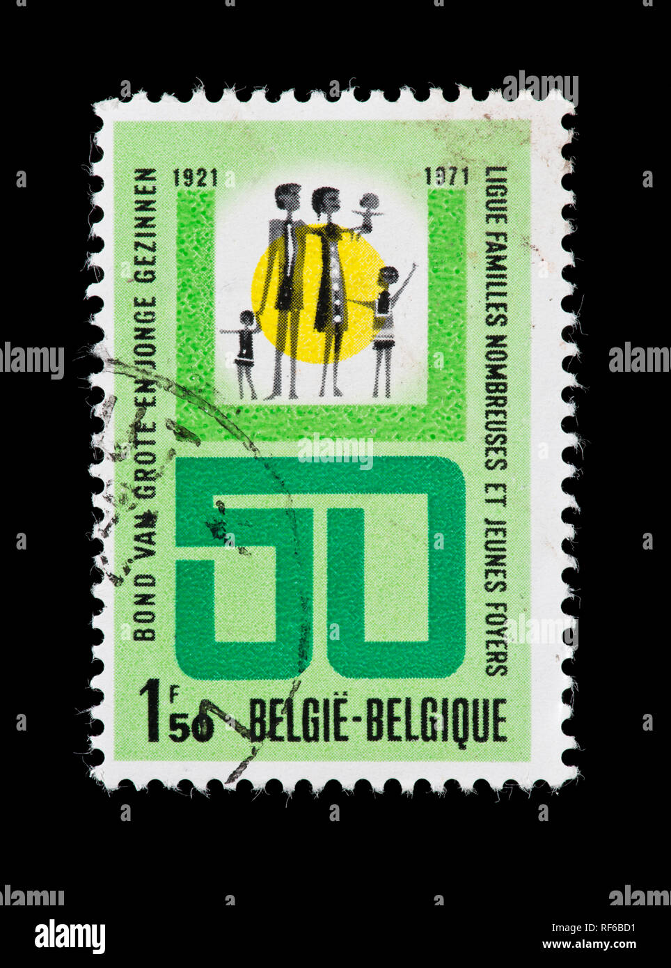 Postage stamp from Belgium depicting a family and a 50, issued for the 50th anniversary of the Belgian Large Family League. Stock Photo