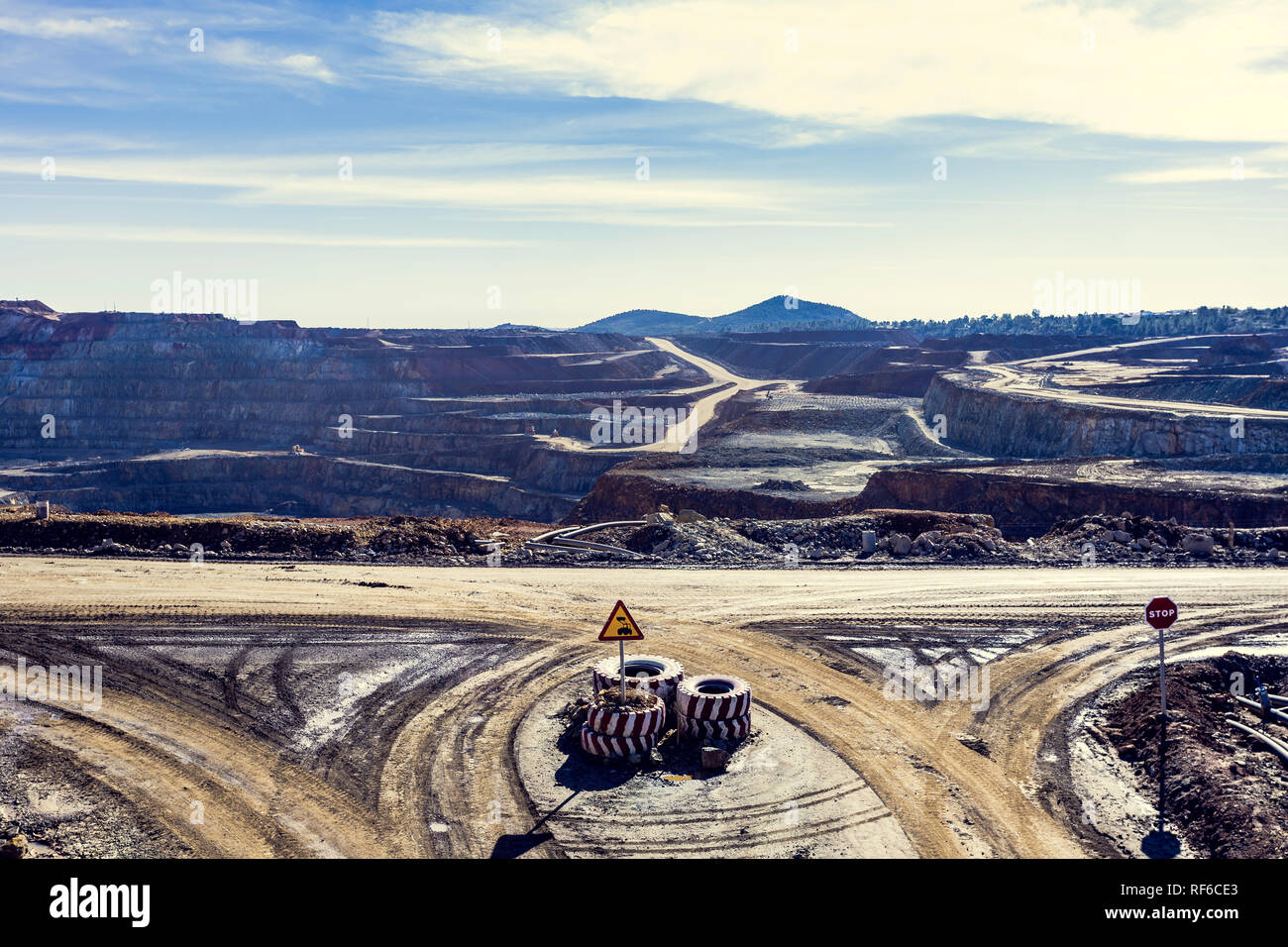 Aerial view of the Riotinto opencast mining quarry with blue sky and
