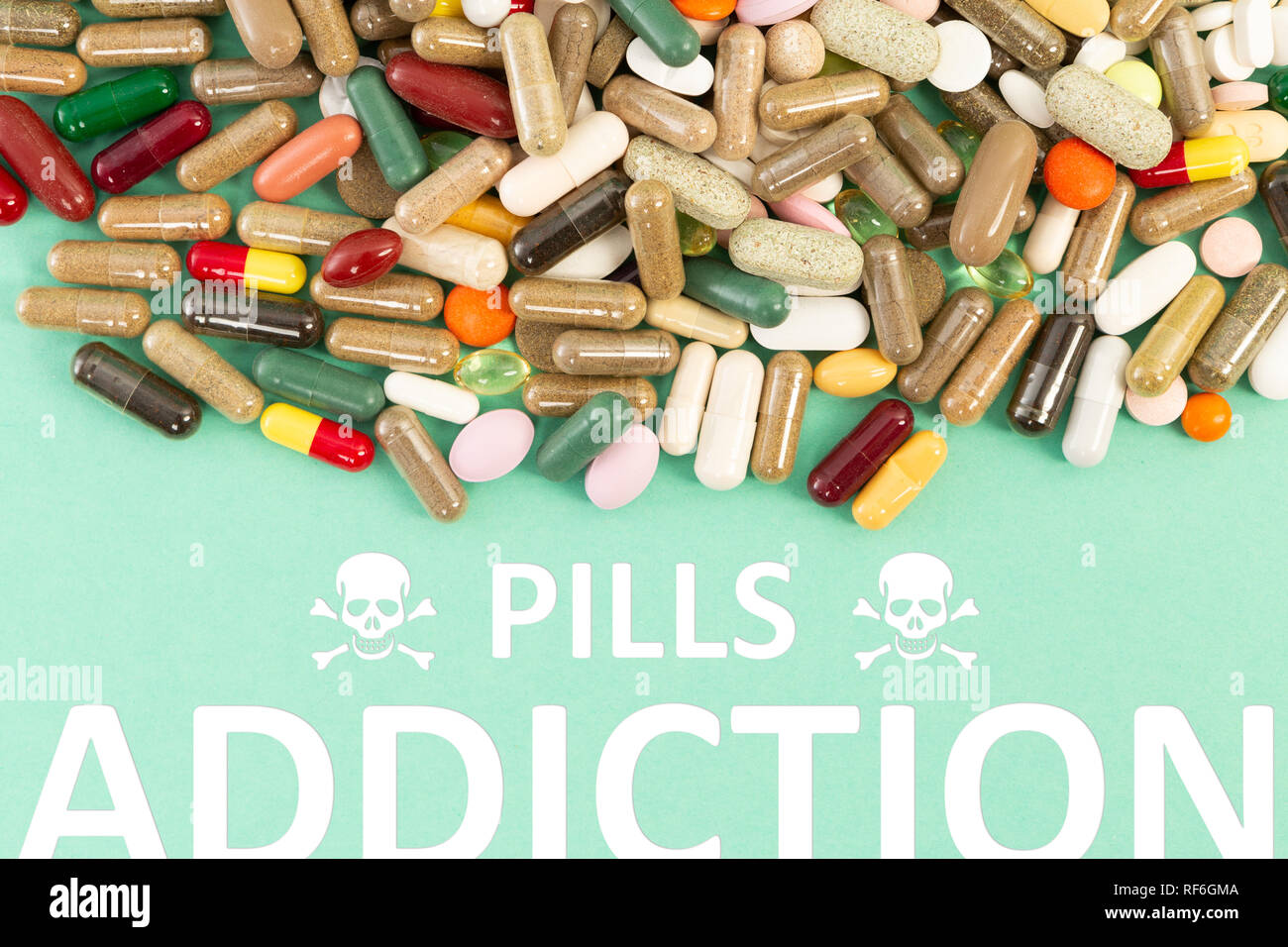 Pills addiction concept with various drugs and health hazard skull symbol Stock Photo