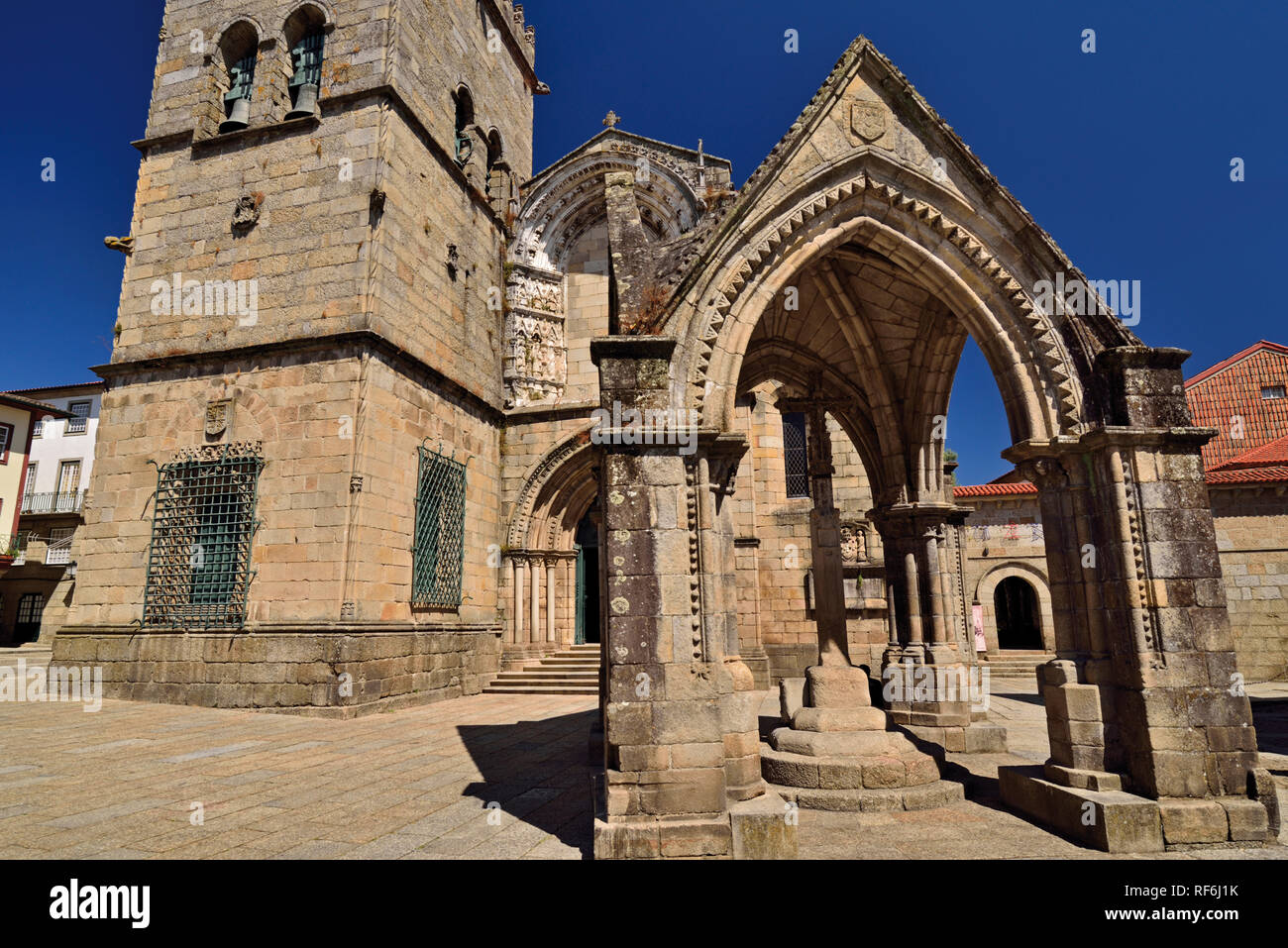 Historic arch and church in Unesco World Heritage town Guimaraes Stock Photo