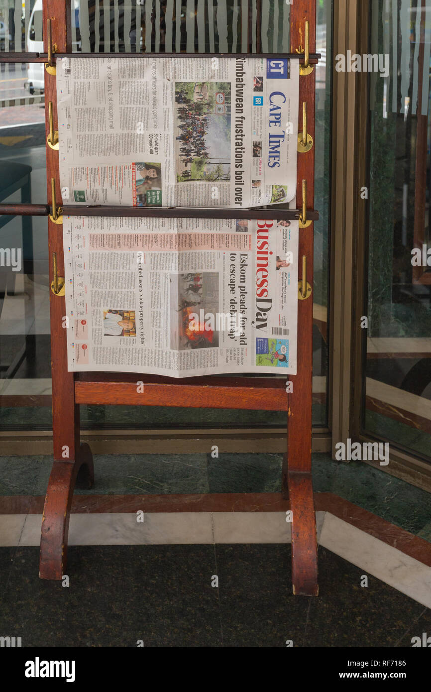 South African newspapers on newspaper stand outside a building in Cape Town, South Africa Stock Photo