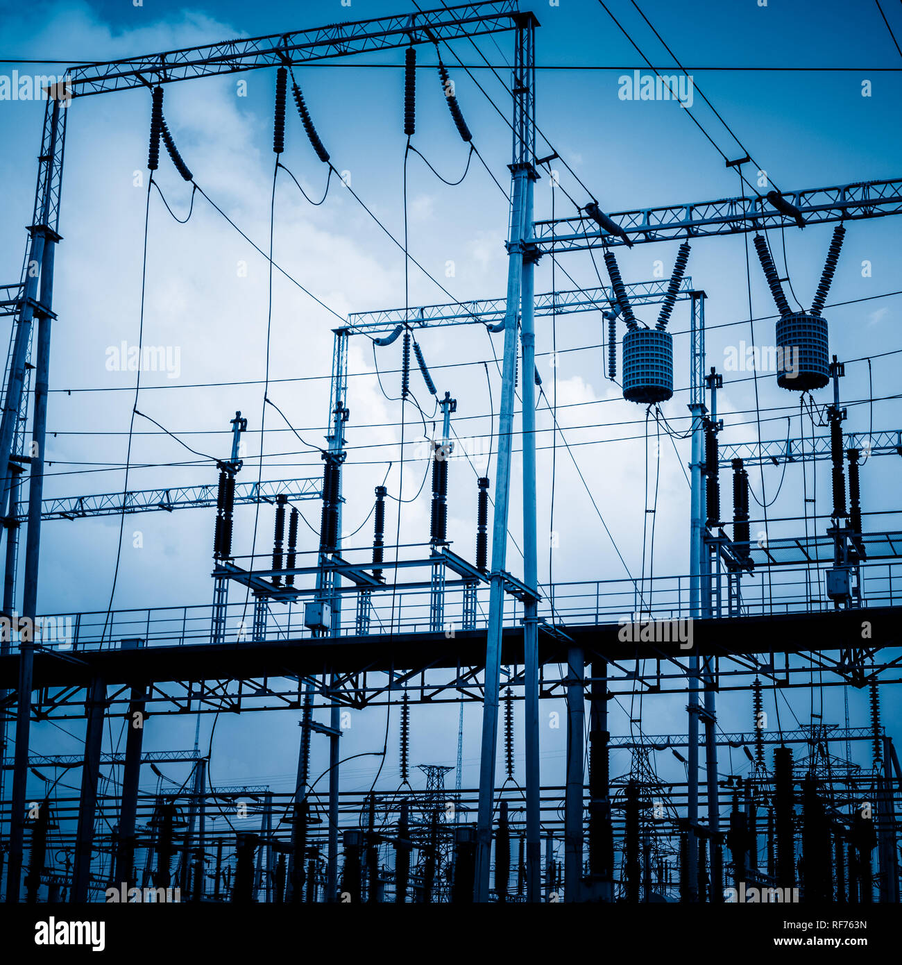 High voltage towers with sky background Stock Photo - Alamy