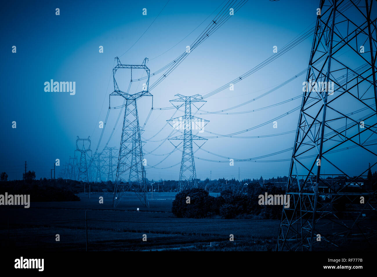 High voltage towers with sky background Stock Photo - Alamy