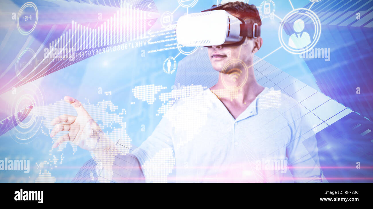 Composite image of man using virtual reality headset Stock Photo
