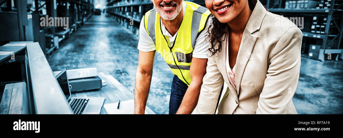 Portrait of warehouse manager and worker working together Stock Photo ...